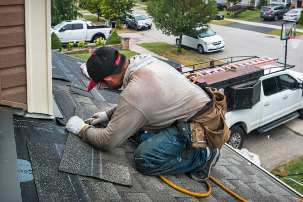 Professional Roofing technician working in Oxford, MA